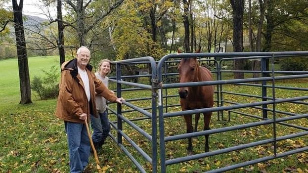 Roy Harris, a patient of Intrepid USA Healthcare Services poses with his granddaughter, Anna Harris, and horse in Eagle Rock, Virginia.